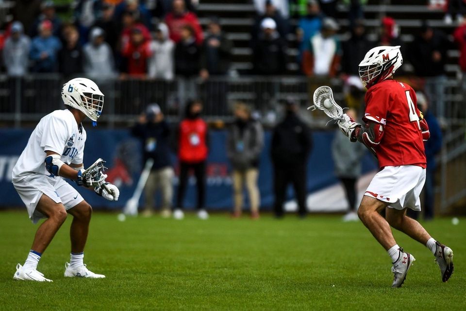 Duke's Jake Caputo (6) guards Maryland's Eric Malever