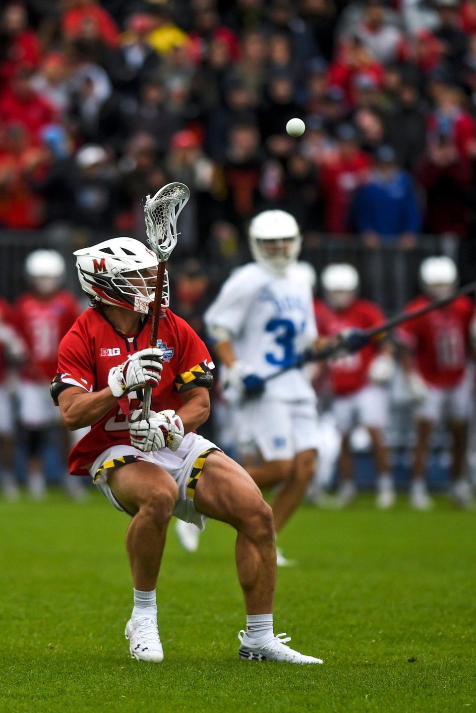 Maryland's Roman Puglise (8) passes the ball down