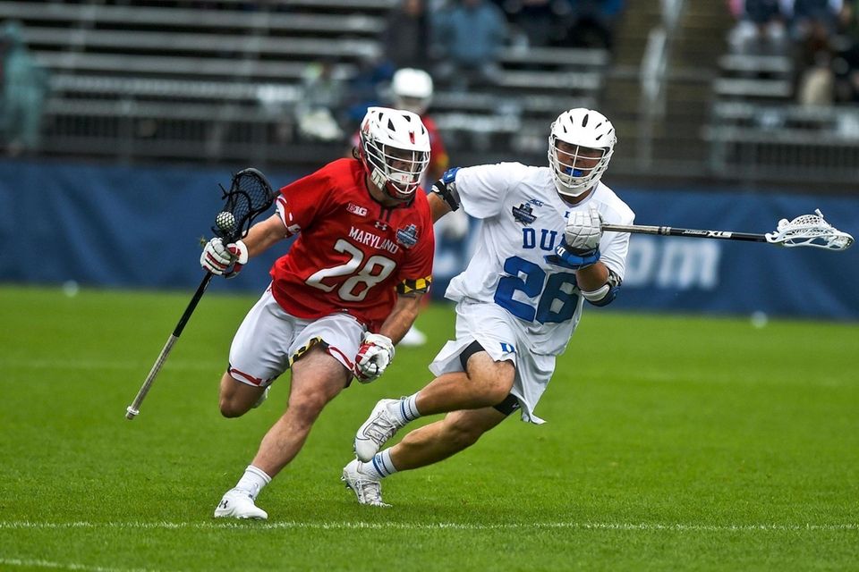 Maryland's Joshua Coffman (28) is guarded by Duke's