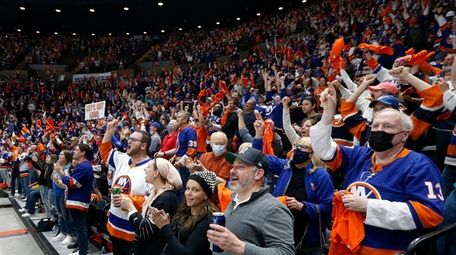 Islanders fans cheer a goal against the Pittsburgh