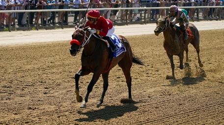 Letruska, with jockey Jose Ortiz up, crosses the