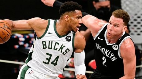 Giannis Antetokounmpo of the Milwaukee Bucks is defended