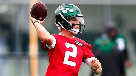 Jets quarterback Zach Wilson throws during OTAs at