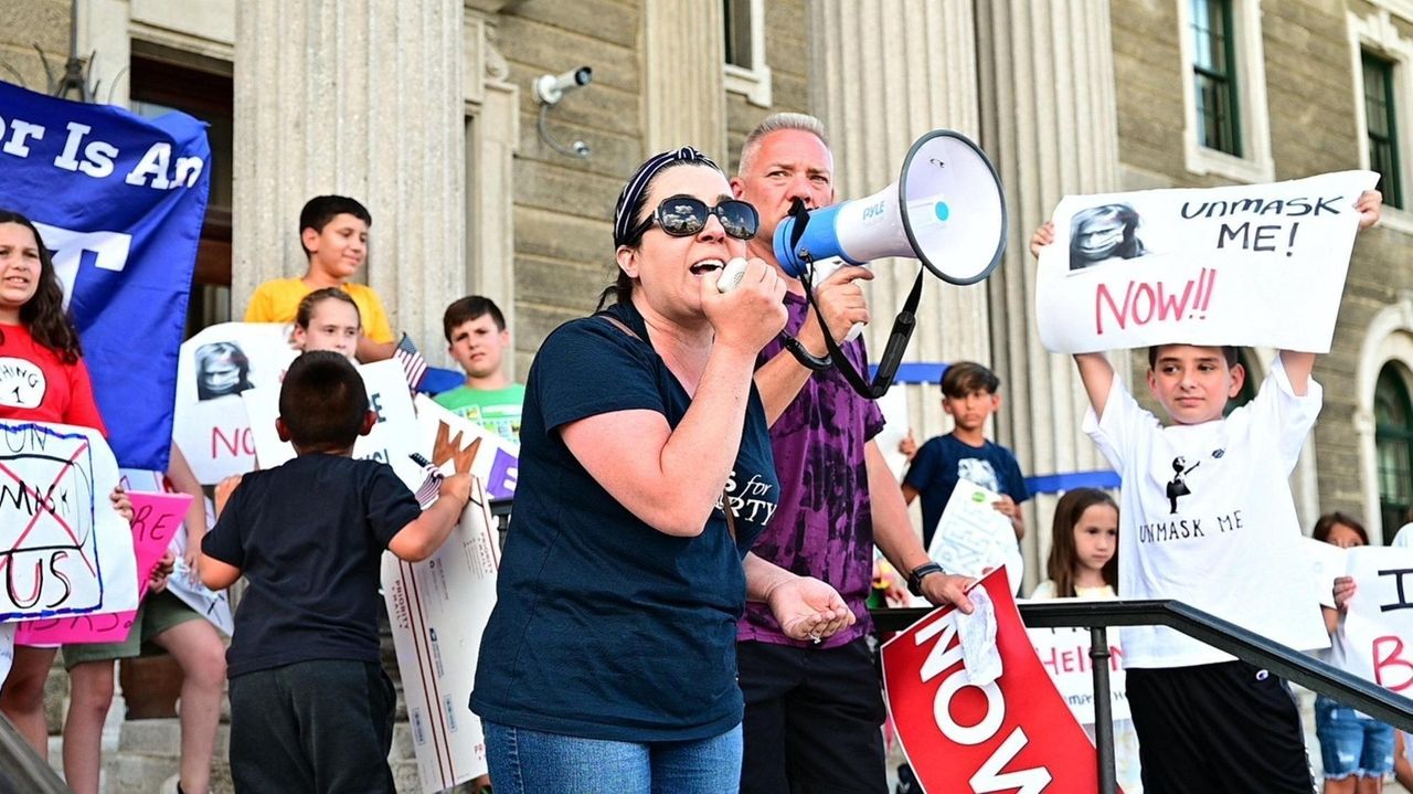 Demonstrators held a rally in Mineola on Wednesday to demand
