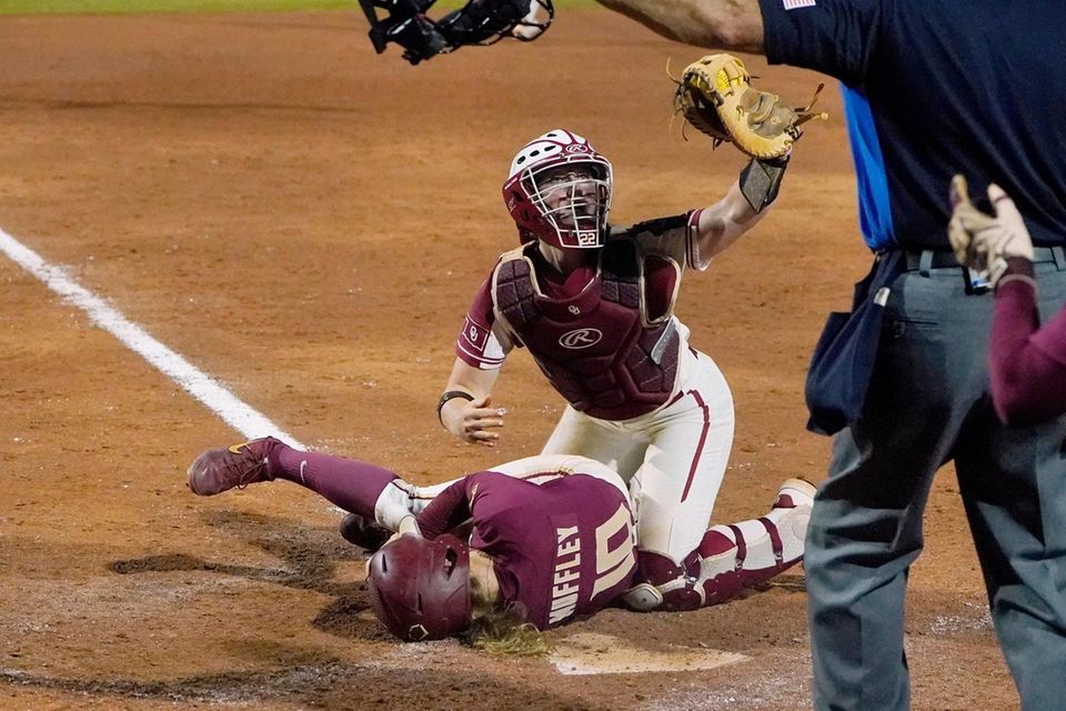 Oklahoma's Lynnsie Elam, right gestures to the home