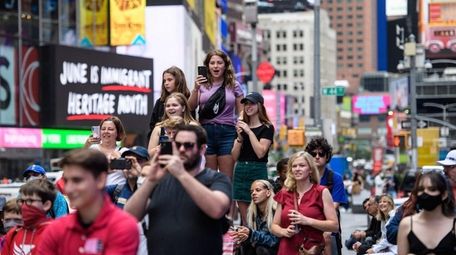 People watch a pop up event in Times