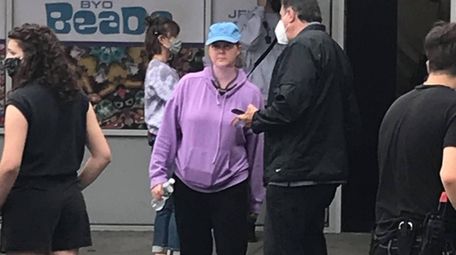 Amy Schumer, in lilac hoodie, shoots a scene
