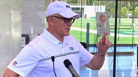 Jets owner and chairman Woody Johnson speaks to