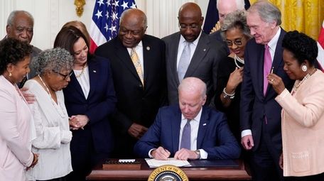 President Joe Biden signs the Juneteenth National Independence
