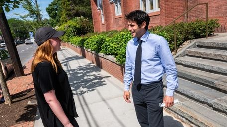 Southampton Village Mayor Jesse Warren, right, chats with