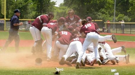 Garden City celebrates after winning the Long Island