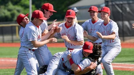 East Islip players celebrate after winning the Long