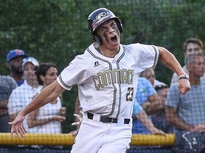 Johnny Catuosco of Commack crosses the plate to