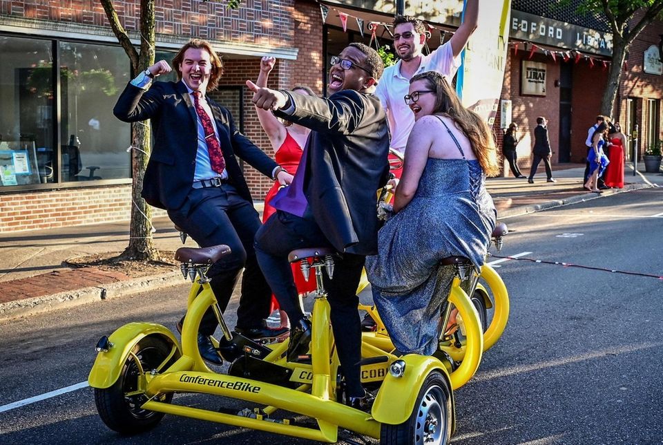 Students ride along Main Street in Patchogue on