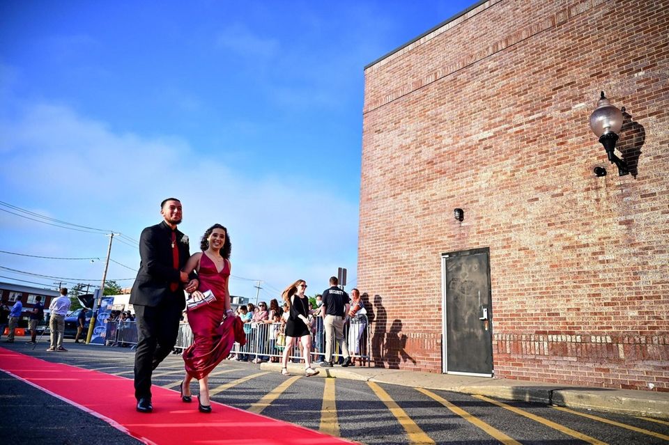 Justin Ramos and Kriscia Mendoza walk the red