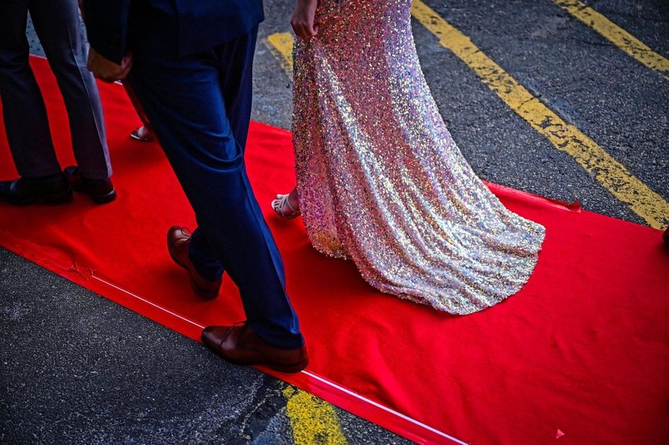 Students walk the red carpet as they attend