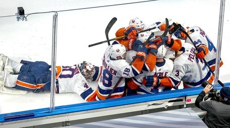 Jordan Eberle of the Islanders is congratulated by