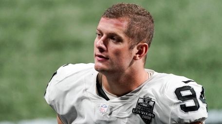 Raiders defensive end Carl Nassib leaves the field