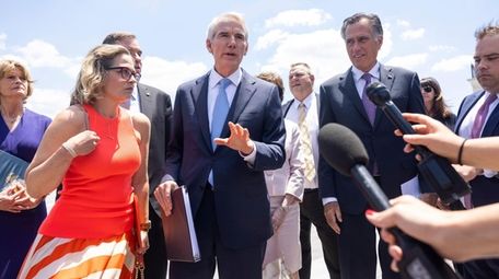 Senators, including Kyrsten Sinema (D-Ariz.), Rob Portman (R-Ohio),