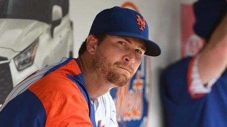 Mets starting pitcher Jacob deGrom looks on from
