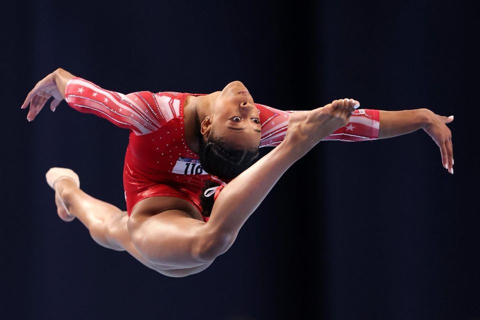 Amari Drayton competes in the floor exercise during