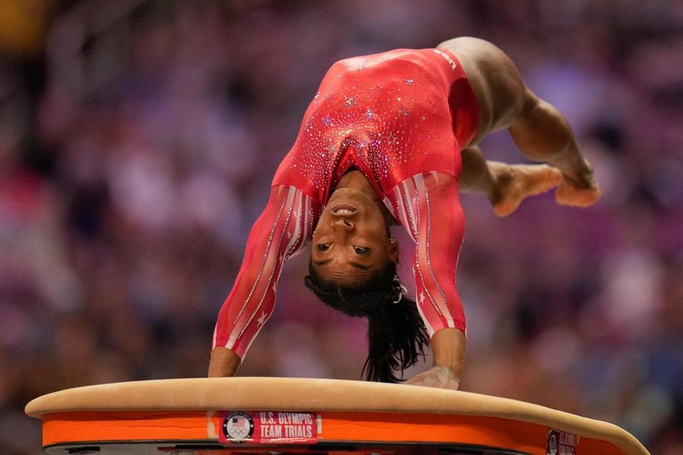 Simone Biles competes on the vault during the