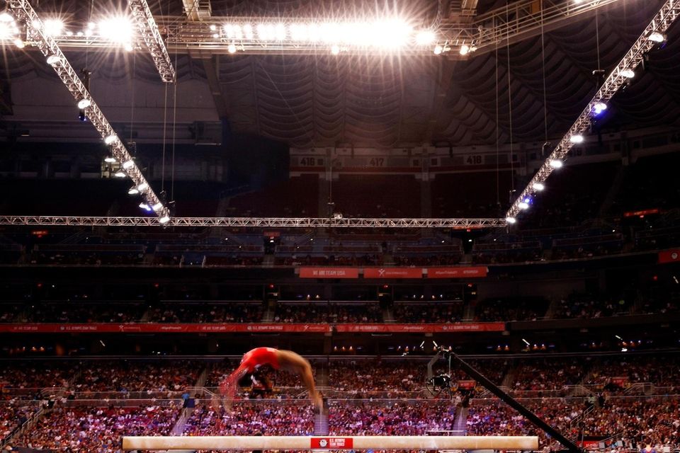 Simone Biles competes on the balance beam during