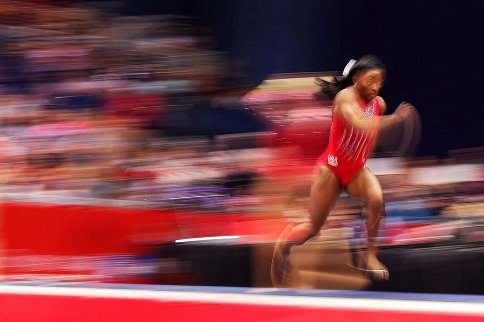 Simone Biles warms up on the vault prior
