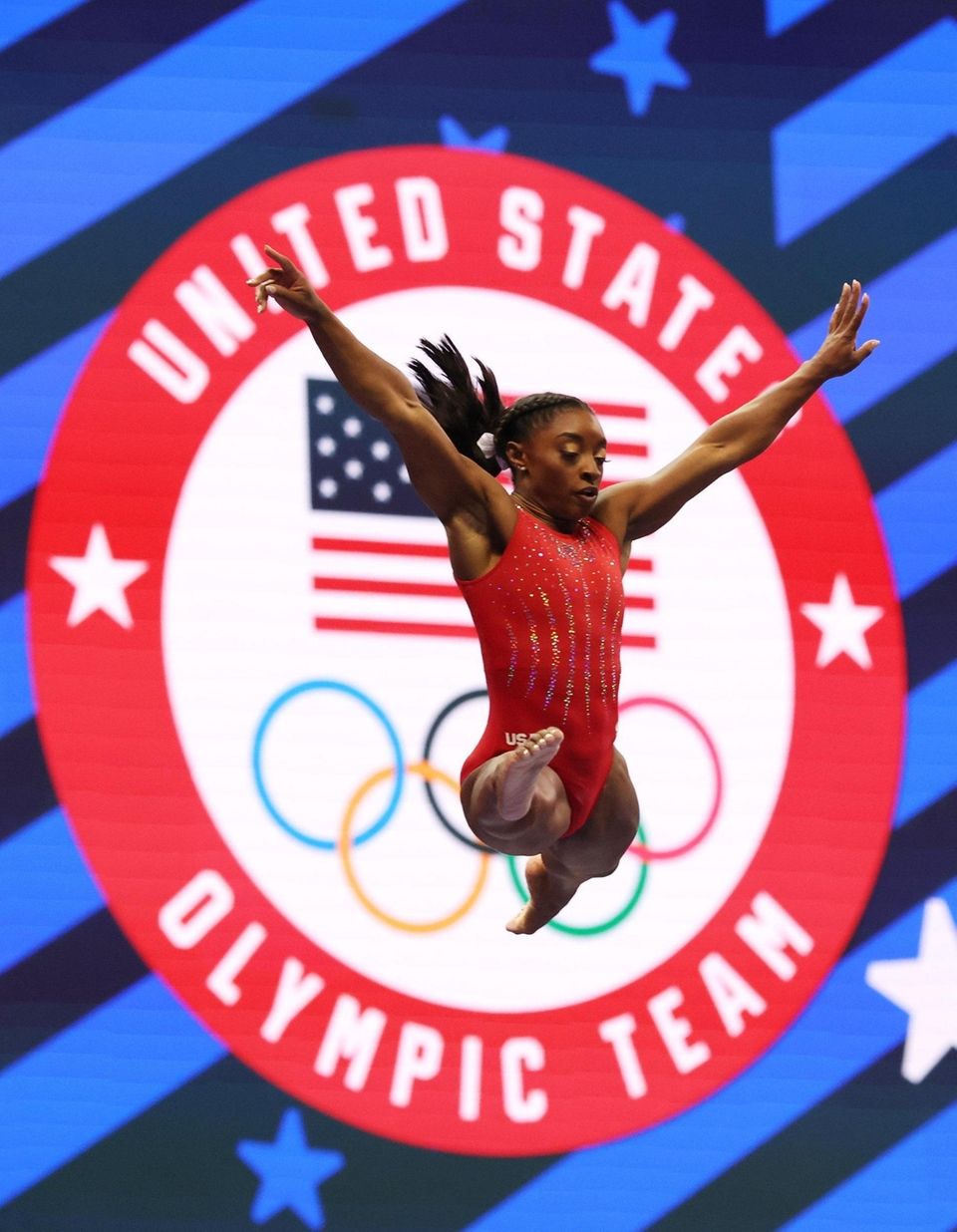 Simone Biles warms up on the balance beam