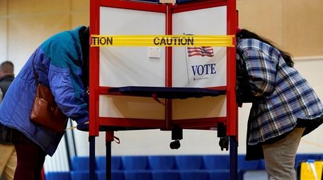 Caution tape closes off a voting stall to