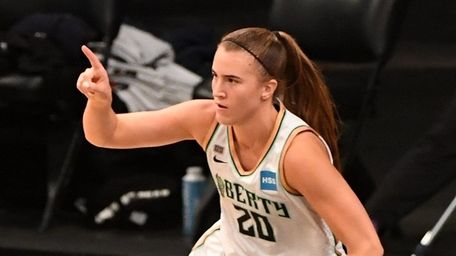 Liberty guard Sabrina Ionescu reacts after she scores