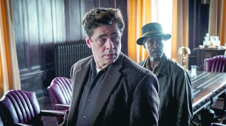 Benicio Del Toro (L) and Don Cheadle (R)