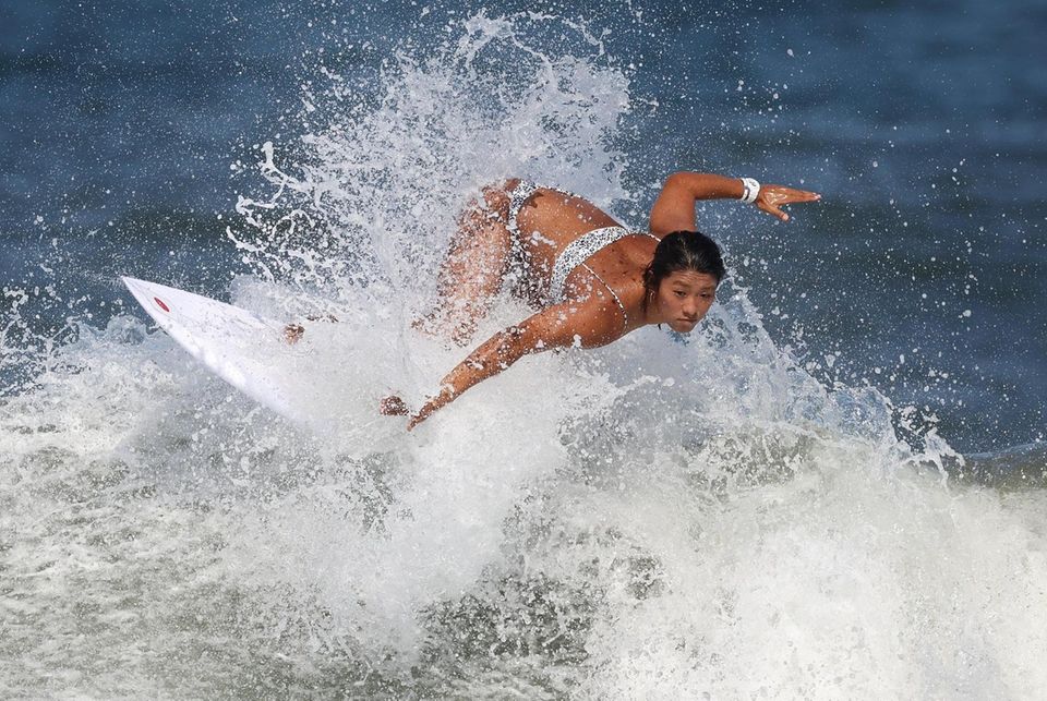 Mahina Maeda of Team Japan surfs during a