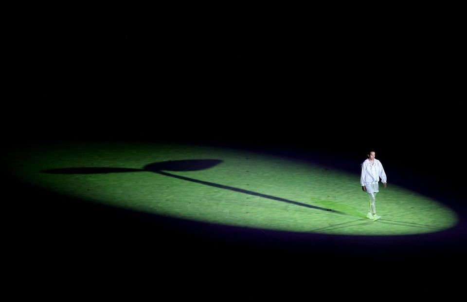 A performer is seen acting during the Opening