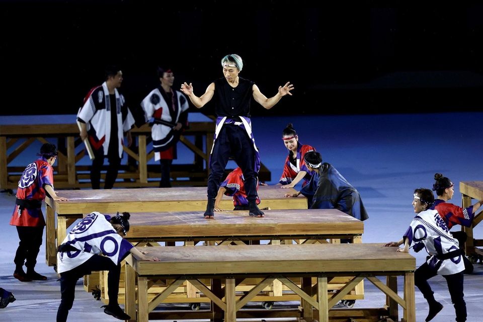 A group of performers carry out a routine