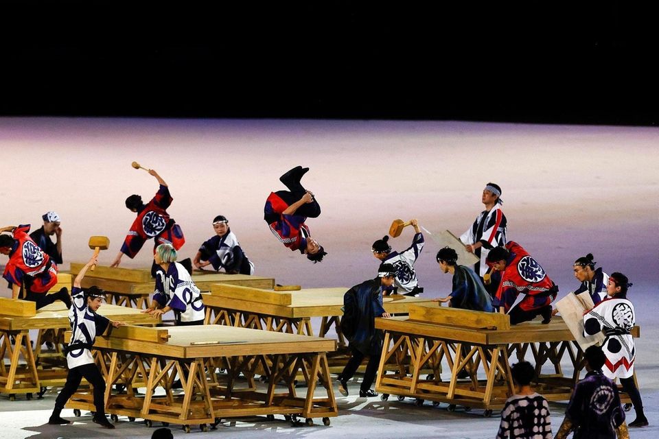 Performers in action during the Opening Ceremony of