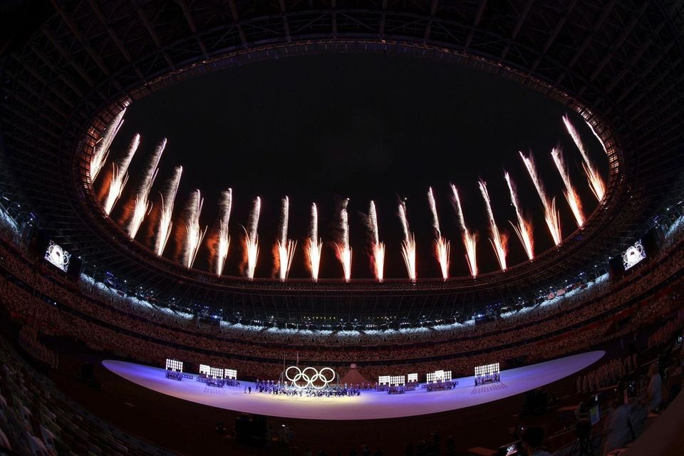 Fireworks go off inside the stadium during the