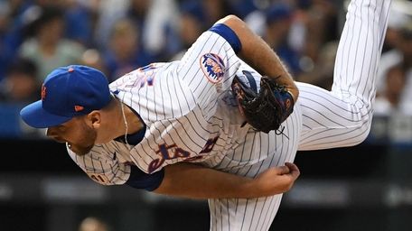 Mets starting pitcher Tylor Megill delivers against the