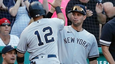 The Yankees' Rougned Odor celebrates after scoring on