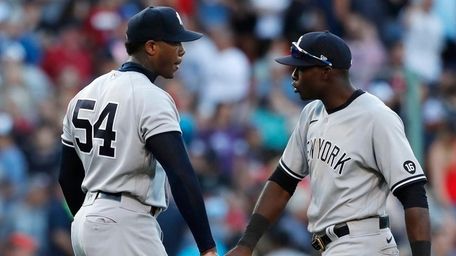 Yankees' Aroldis Chapman and Estevan Florial celebrate after