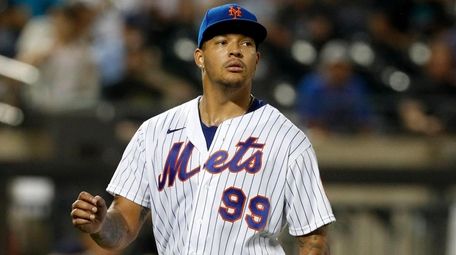 Taijuan Walker of the Mets walks to the