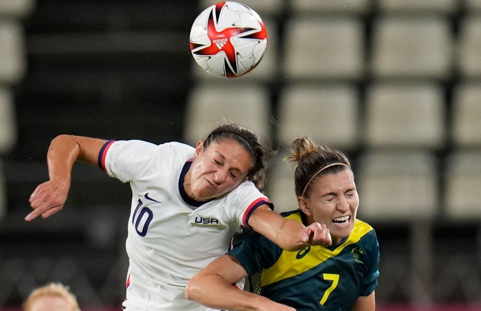 United States' Carli Lloyd, left, and Australia's Steph