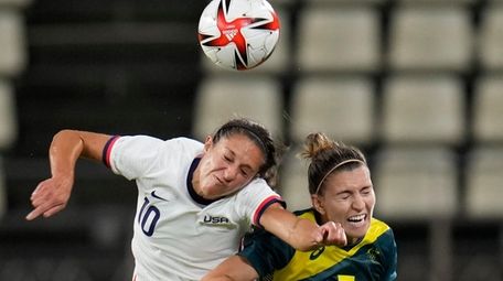 United States' Carli Lloyd, left, and Australia's Steph