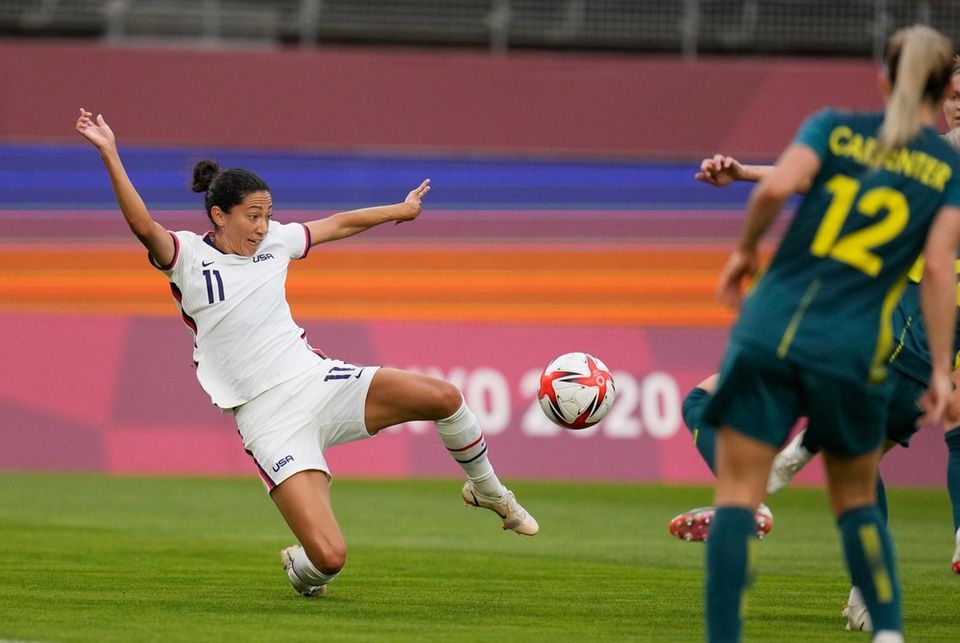 United States' Christen Press, left, goes for the