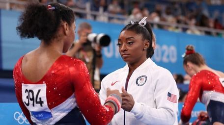 Simone Biles talks with Jordan Chiles of Team