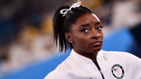 Simone Biles reacts during the artistic gymnastics women's