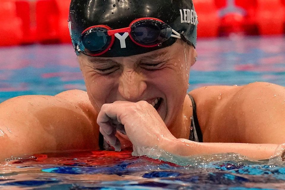 Katie Ledecky, of the United States, reacts after