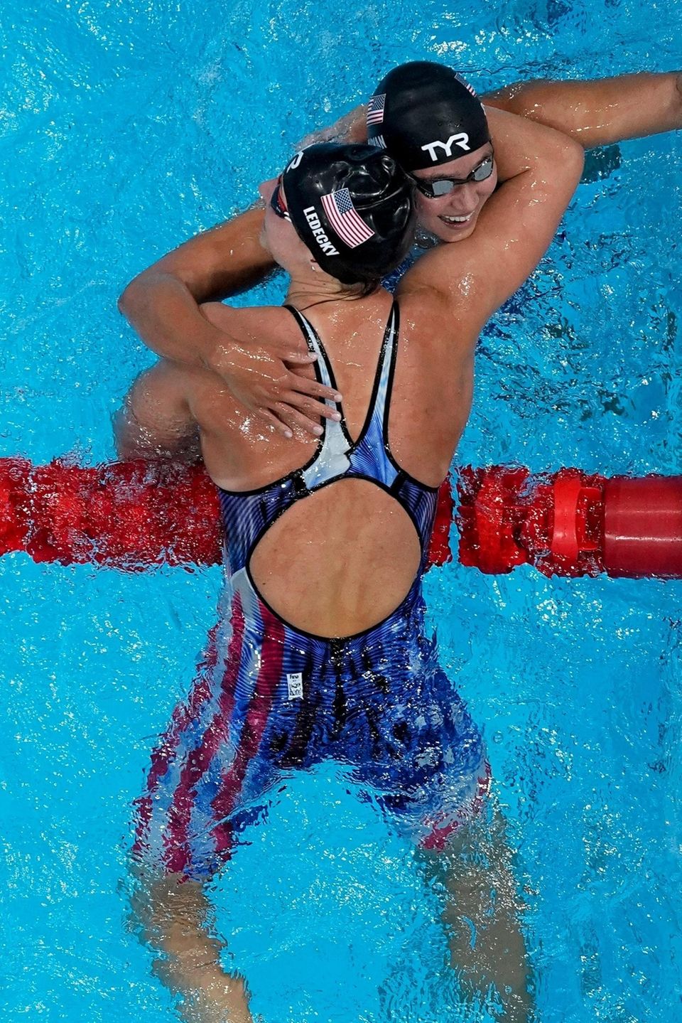 Katie Ledecky, of the United States, is congratulated