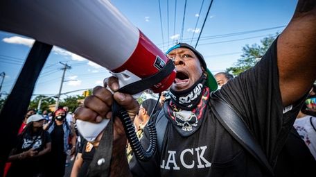 Demonstrators call for justice for George Floyd in