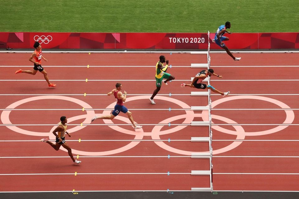 Athletes compete during round one of the Men's